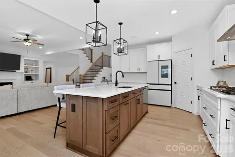 a kitchen with a counter space cabinets and appliances