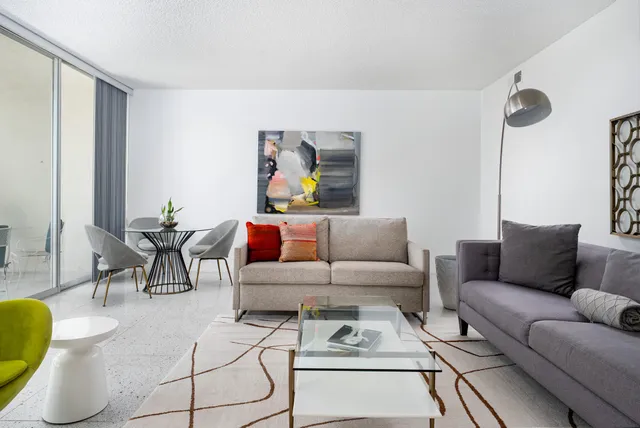 a living room with furniture and a rug