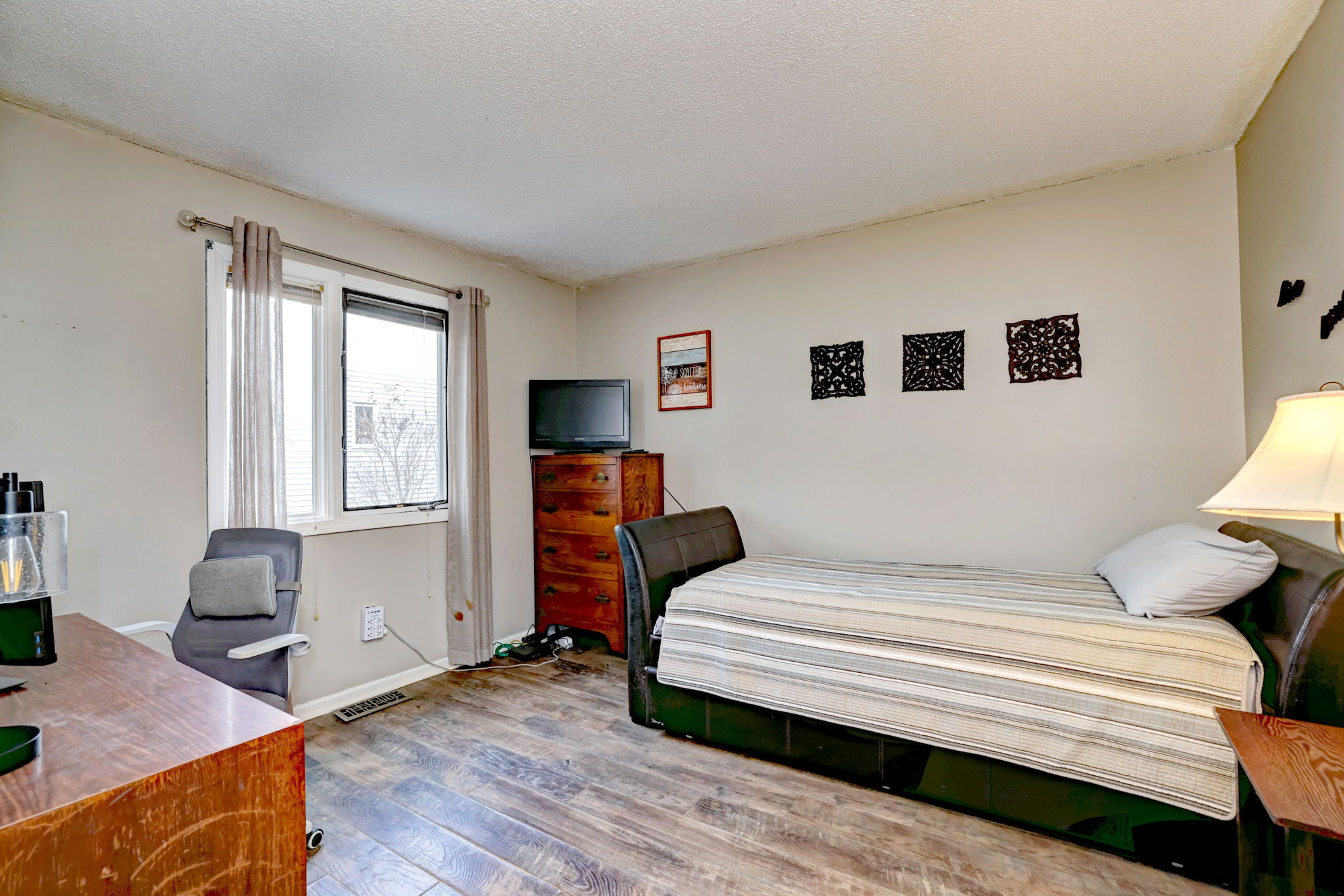 1480 Capitol Avenue, Unit H811 Bridgeport, CT 06604 - Photo 28 of 39 a bedroom with a bed and wooden floor