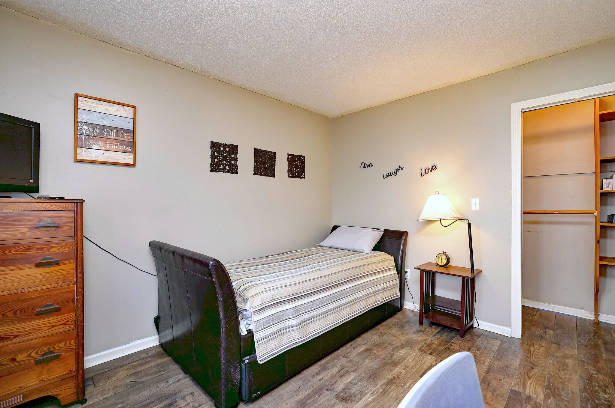 1480 Capitol Avenue, Unit H811 Bridgeport, CT 06604 - Photo 30 of 39 a bedroom with a bed and a flat screen tv