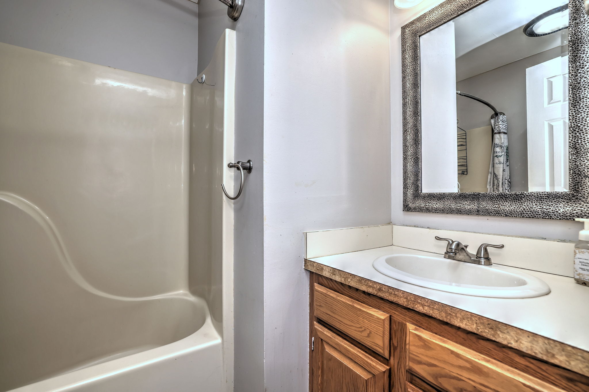 1480 Capitol Avenue, Unit H811 Bridgeport, CT 06604 - Photo 31 of 39 a bathroom with a sink and a mirror