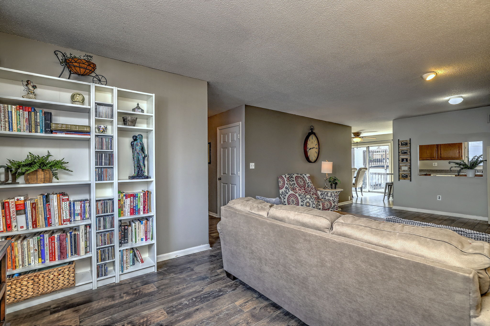 1480 Capitol Avenue, Unit H811 Bridgeport, CT 06604 - Photo 7 of 39 a living room with furniture and a book shelf