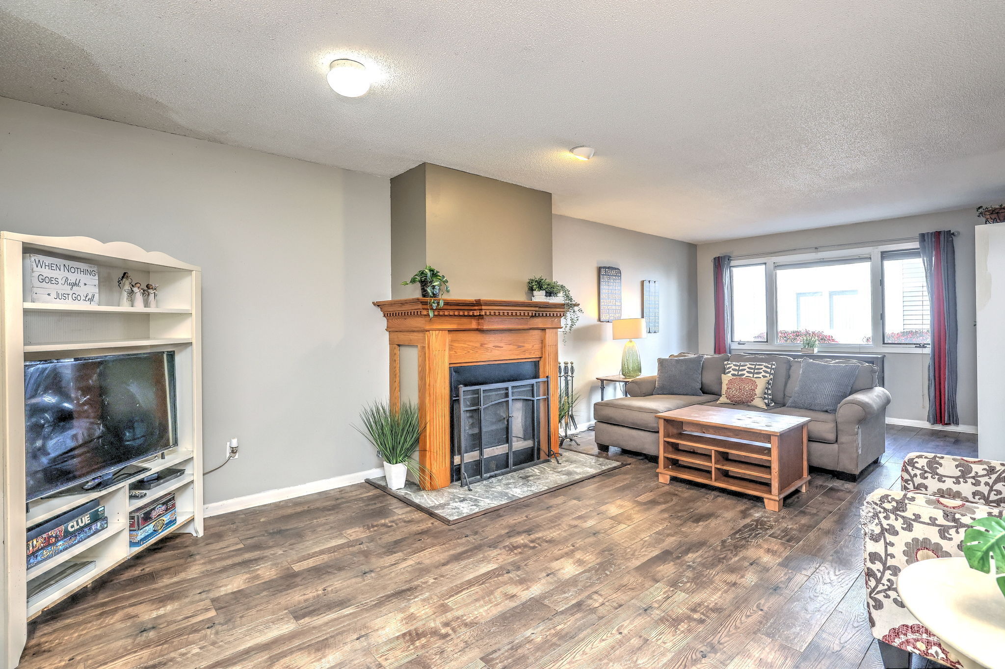 1480 Capitol Avenue, Unit H811 Bridgeport, CT 06604 - Photo 9 of 39 a living room with furniture and a flat screen tv