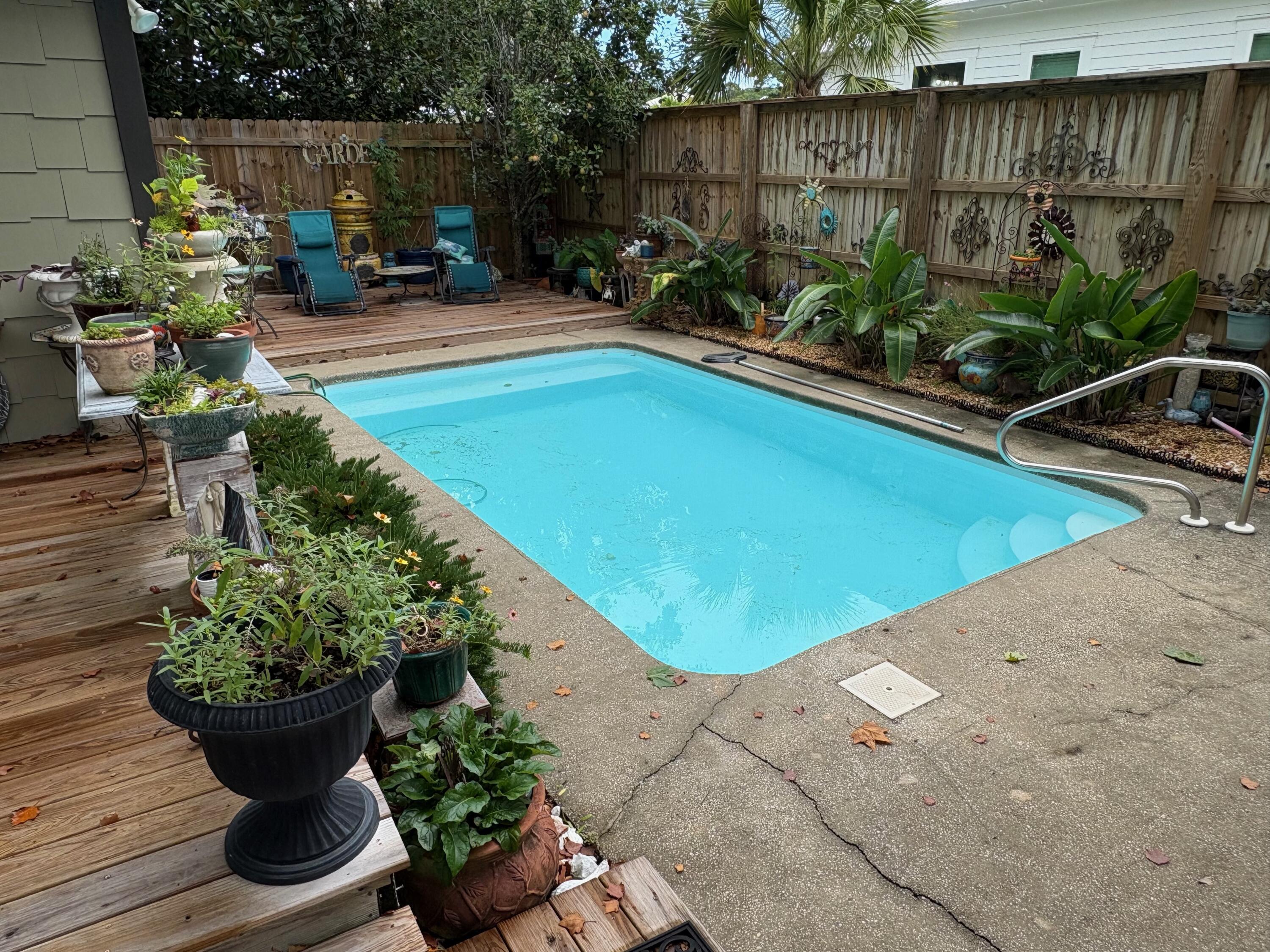 a view of a backyard with sitting area