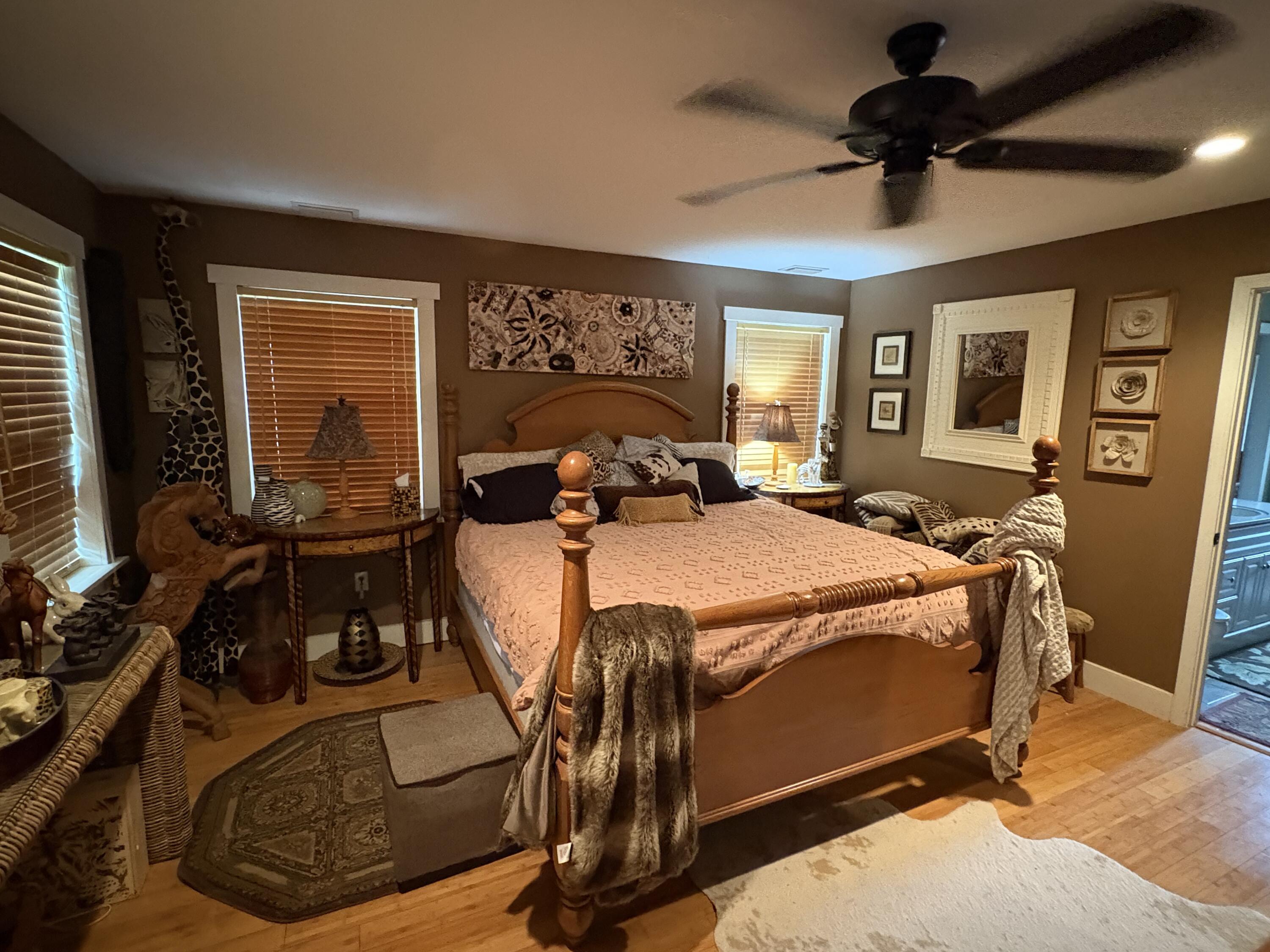 335 Acacia Street Santa Rosa Beach, FL 32459 - Photo 13 of 36 a bed sitting in a bedroom next to a window