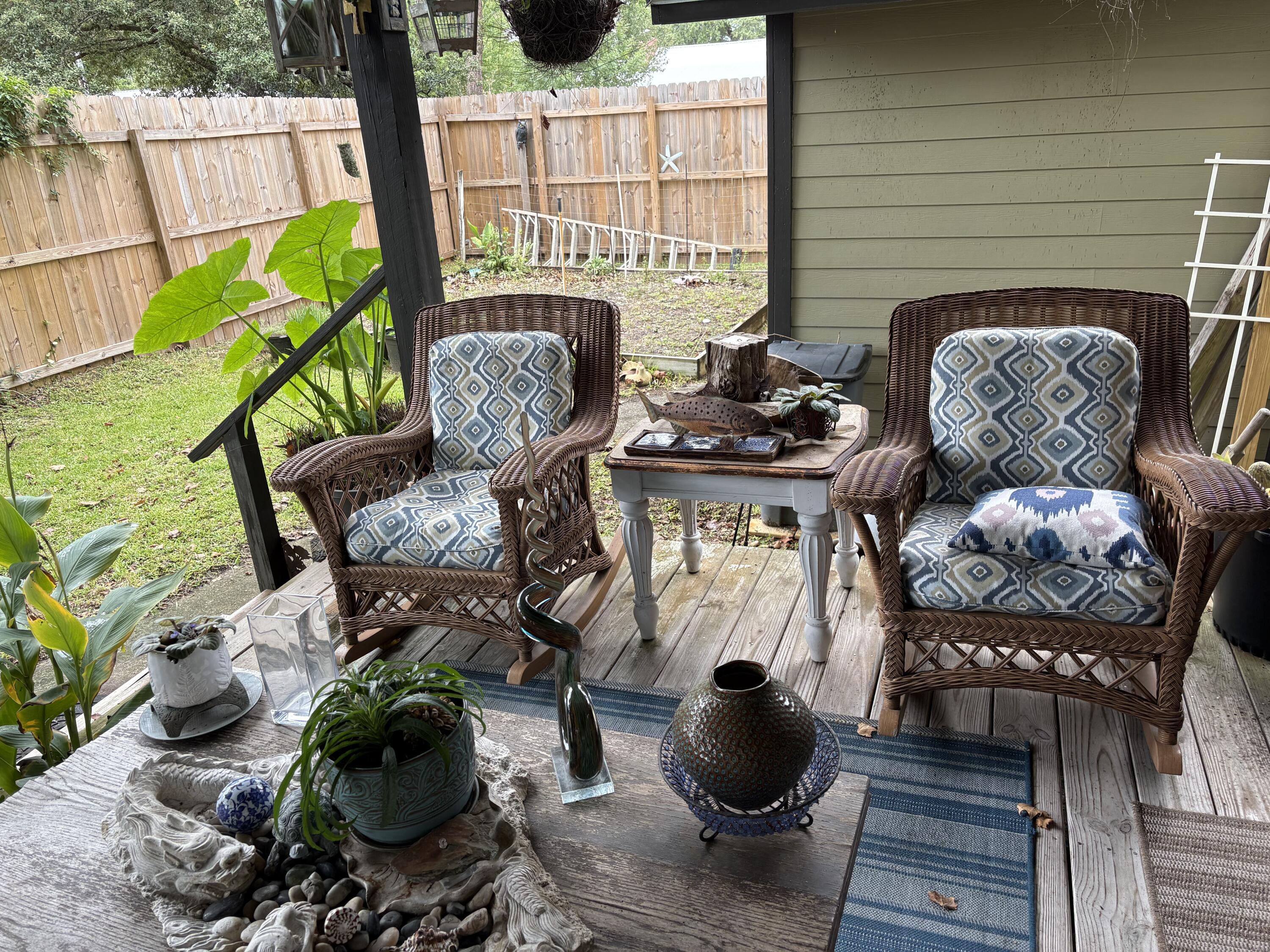335 Acacia Street Santa Rosa Beach, FL 32459 - Photo 21 of 36 a living room with furniture and a potted plant