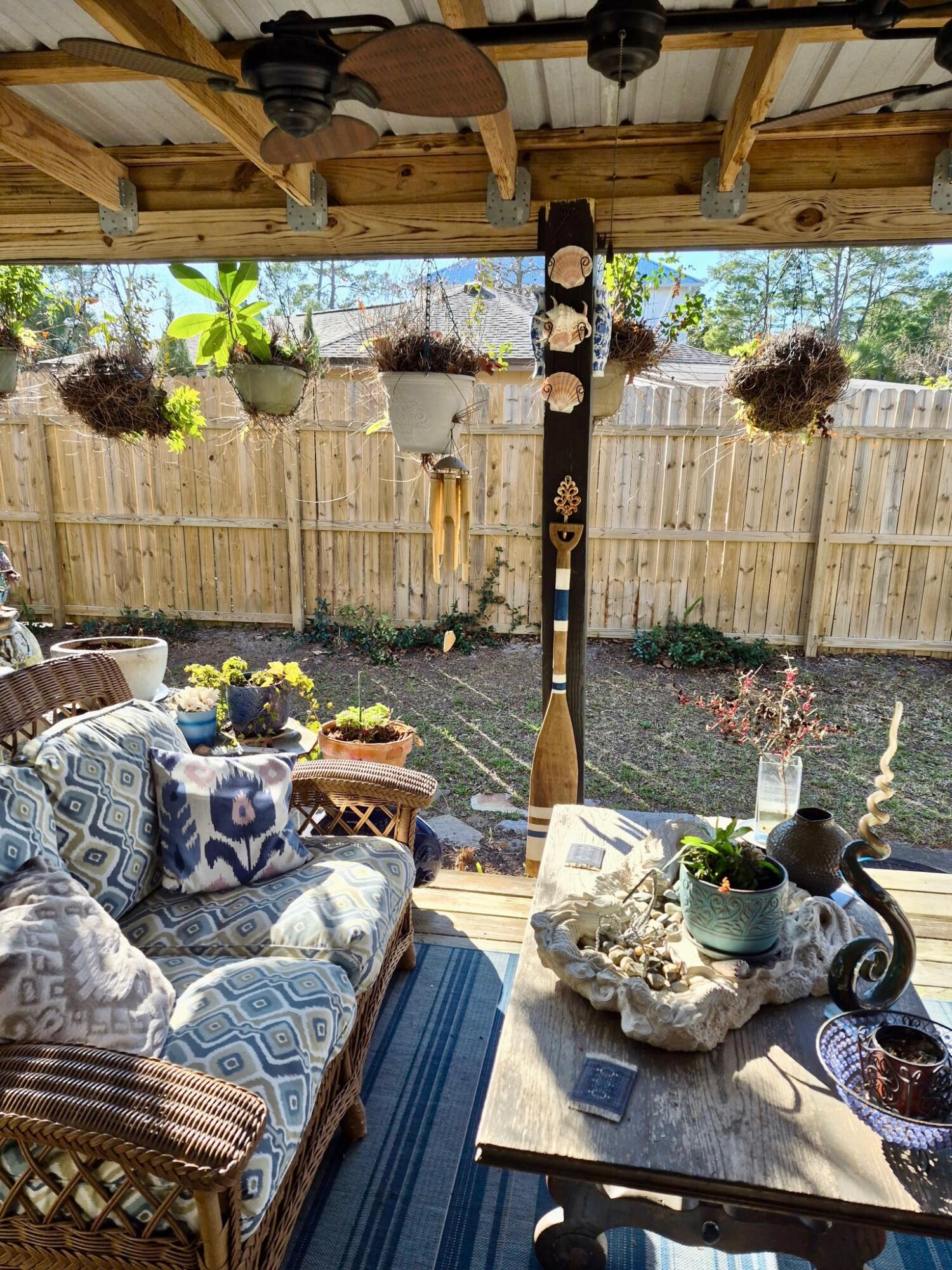 335 Acacia Street Santa Rosa Beach, FL 32459 - Photo 23 of 36 a outdoor living space with furniture