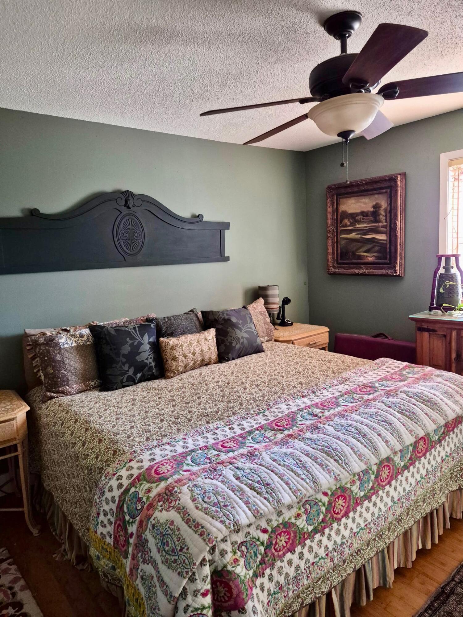 335 Acacia Street Santa Rosa Beach, FL 32459 - Photo 9 of 36 a bedroom with a large bed and a chandelier