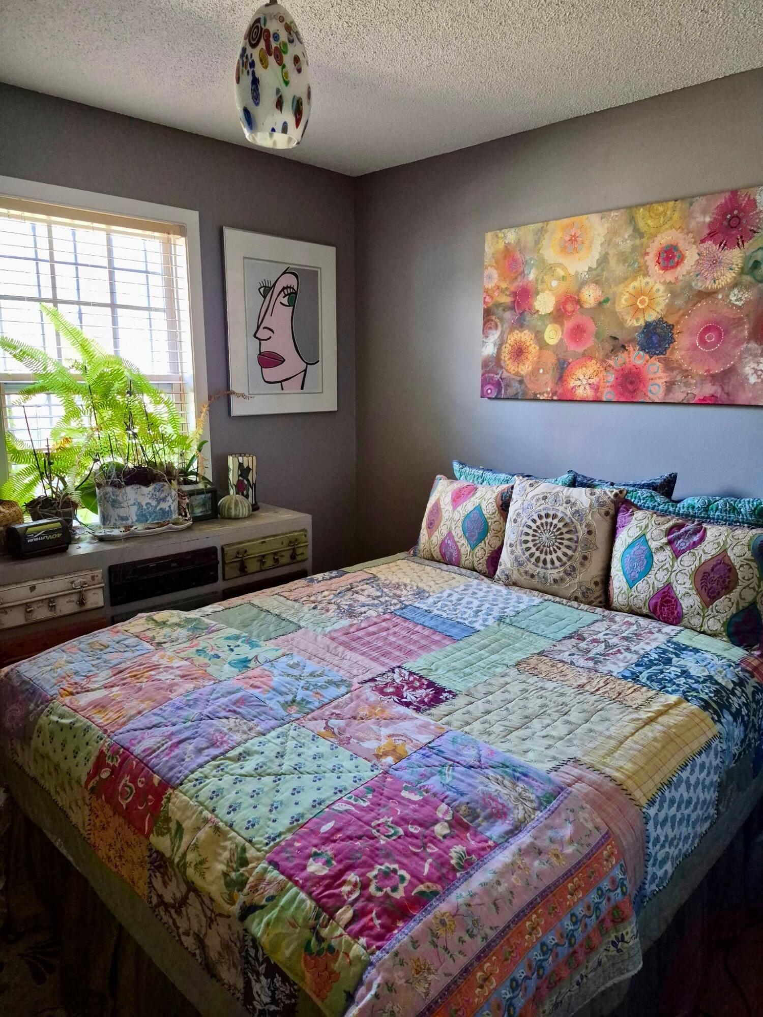 335 Acacia Street Santa Rosa Beach, FL 32459 - Photo 10 of 36 a bedroom with a bed and a painting on the wall