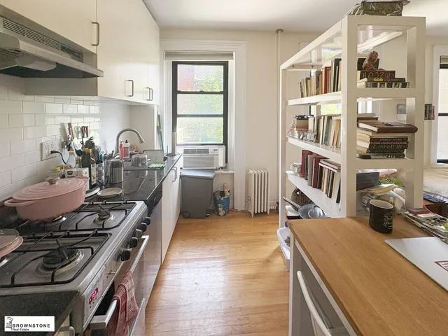 a kitchen with a stove and a sink