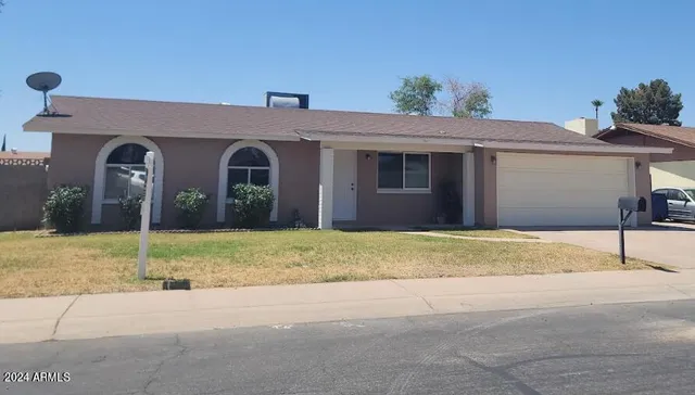 a front view of house along with road