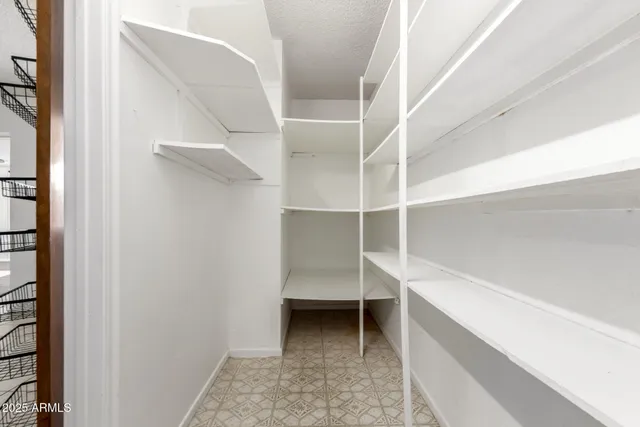a view of an empty walk in closet