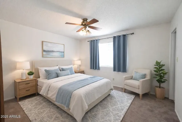 a bedroom with a large bed and a couch