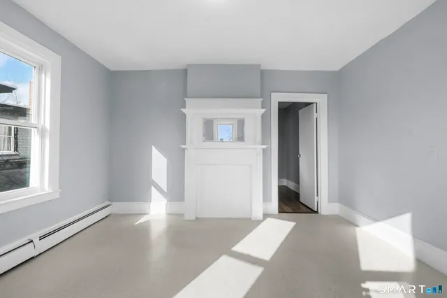 a view of an empty room with a window