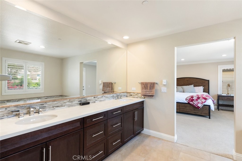 31134 Maverick Lane Temecula, CA 92591 - Photo 14 of 22 a spacious bathroom with a sink double vanity and a mirror