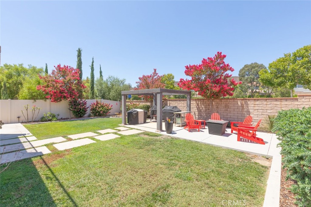 31134 Maverick Lane Temecula, CA 92591 - Photo 22 of 22 a front view of a house with dining space and trees in the background