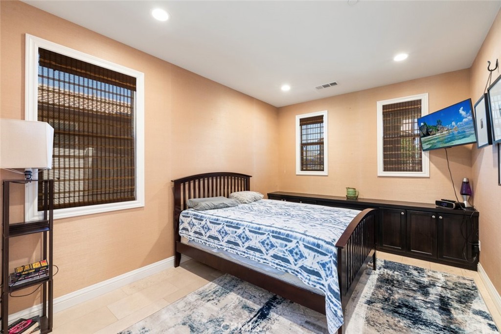 31134 Maverick Lane Temecula, CA 92591 - Photo 6 of 22 a bedroom with a bed and wooden floor