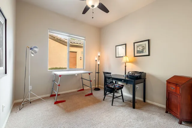 a view of a livingroom with furniture and a flat screen tv