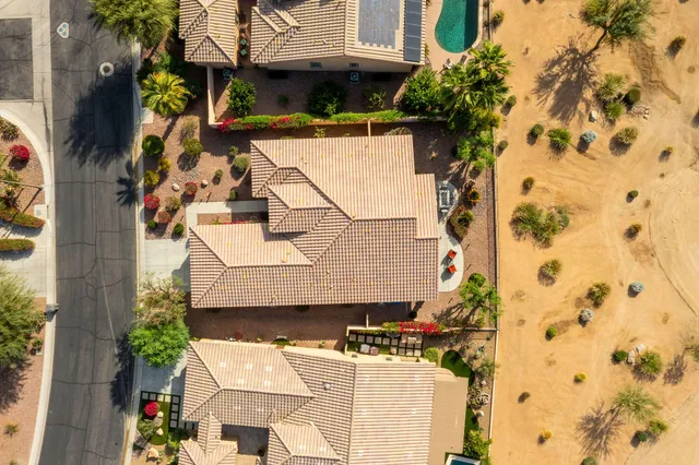a view of swimming pool with outdoor seating and mountain view