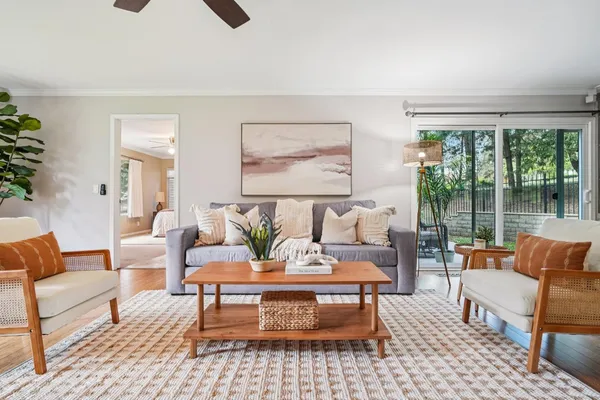 a living room with furniture and a large window