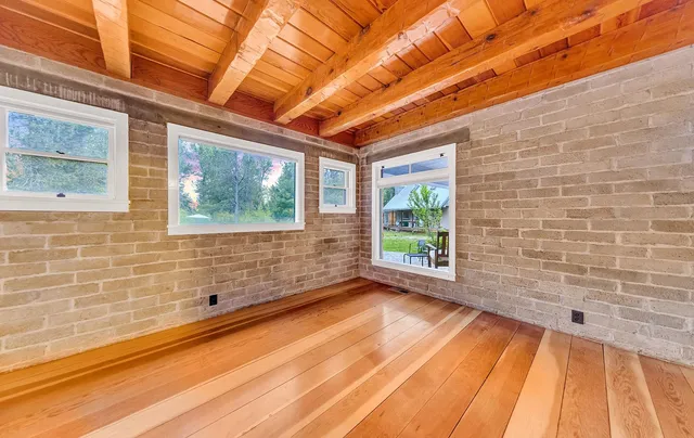 a view of empty room with windows