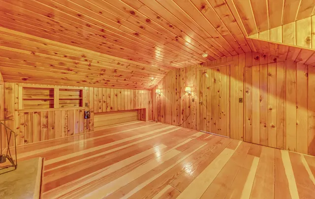 a view of a room with wooden walls