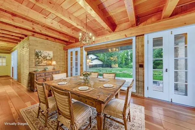 a view of a dining room with furniture window and outside view