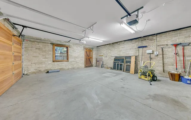 an empty room with furniture and a fireplace