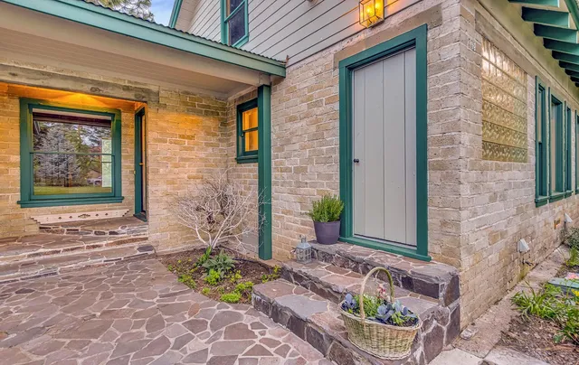 a front view of a house with garden