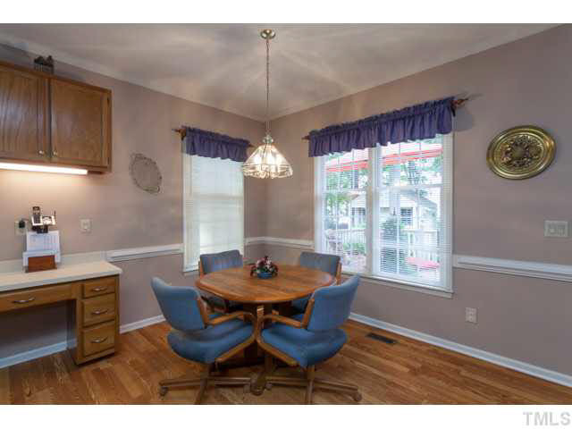 5129 Fairmead Circle Raleigh, NC 27613 - Photo 9 of 25 a view of a dining room with furniture and window