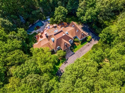 an aerial view of a house with a garden