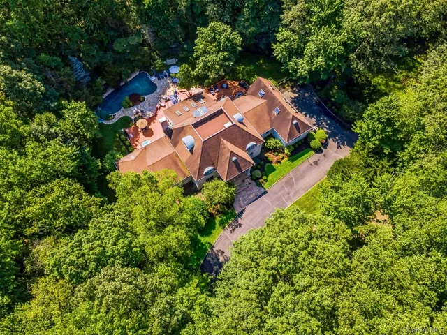 an aerial view of a house with a garden