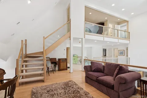 a bedroom with a large bed and a couch