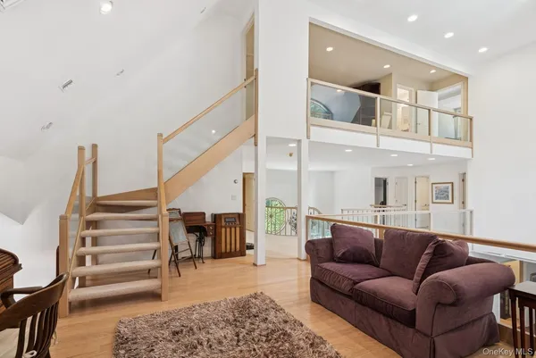 a bedroom with a large bed and a couch