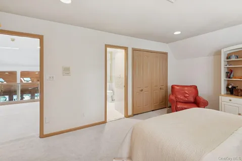 a bathroom with a granite countertop sink a toilet and shower