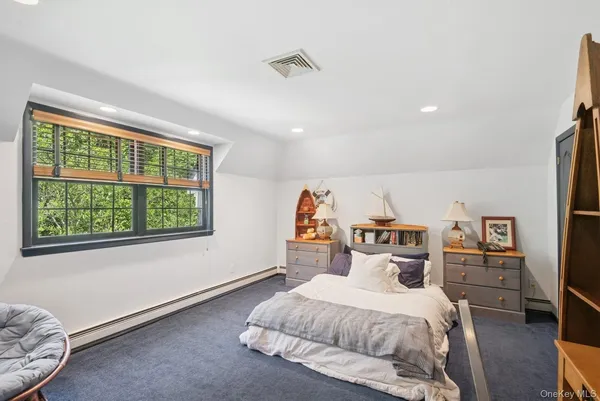 a view of a living room and a kitchen with furniture