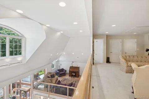 a living room with a couch and a large window