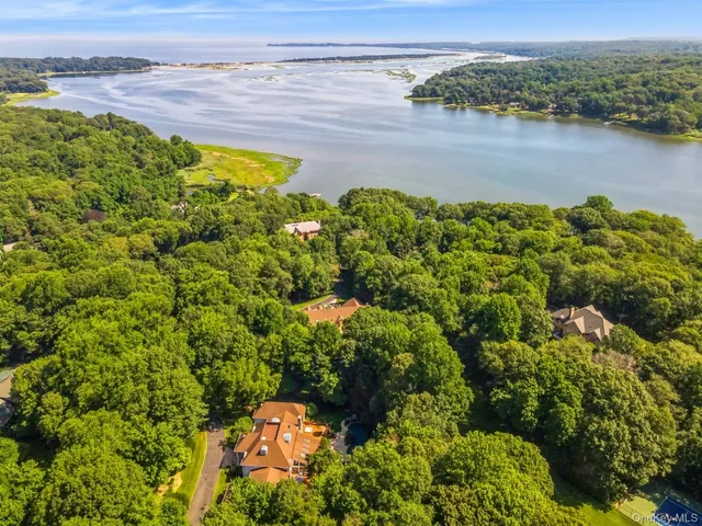 a view of entryway and hall with a front door