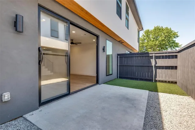 wooden floor in an empty room with a ceiling fan