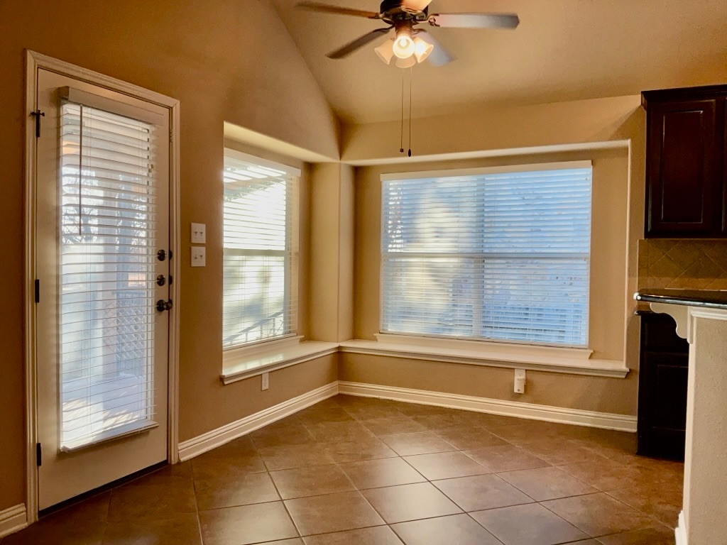 3580 Rosalina Loop Round Rock, TX 78665 - Photo 15 of 27 a view of an empty room with a fireplace and a window
