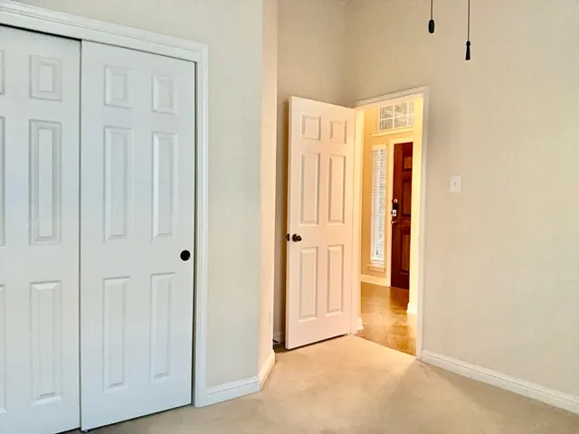 a view of a hallway with closet area