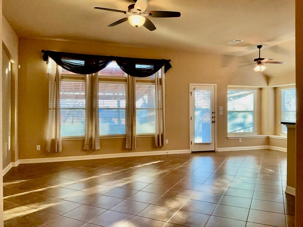 3580 Rosalina Loop Round Rock, TX 78665 - Photo 6 of 27 a view of an entryway with a floor to ceiling window and an entrance