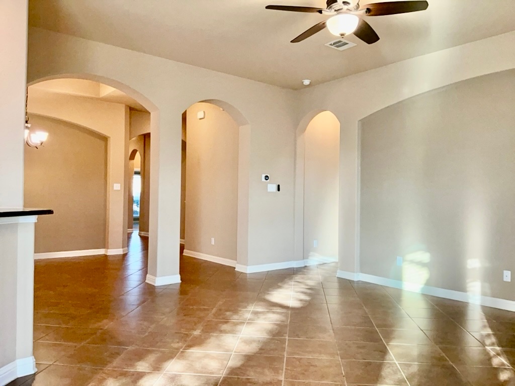 3580 Rosalina Loop Round Rock, TX 78665 - Photo 8 of 27 a view of a big room with windows and chandelier fan