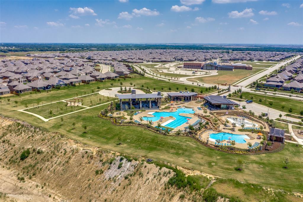 3816 Blacksmith Road Aubrey, TX 76227 - Photo 24 of 30 Community amenities featuring multiple swimming pools, a central clubhouse, and dedicated recreational areas