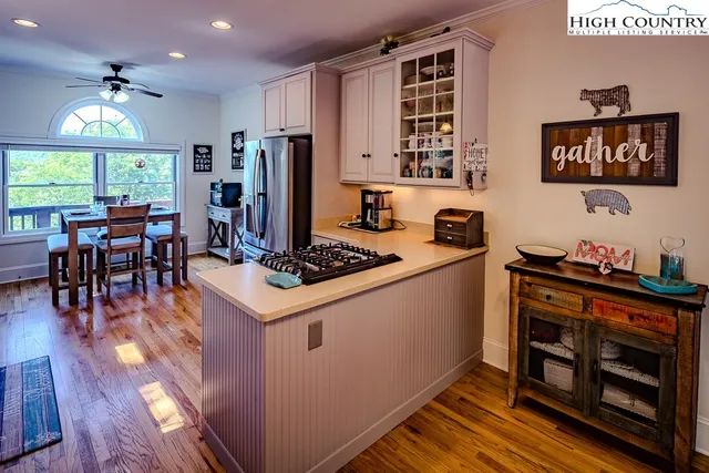 a kitchen with a stove and cabinets