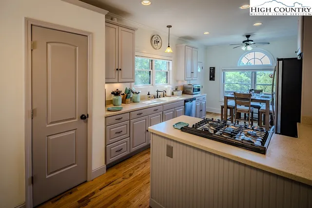 a kitchen with stainless steel appliances granite countertop a stove and a refrigerator