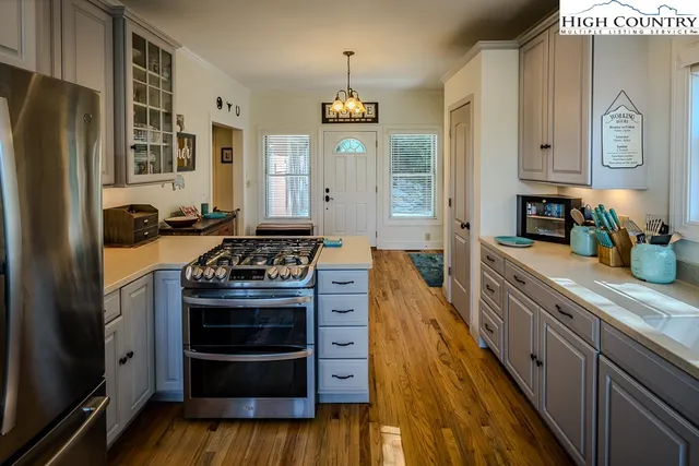 a kitchen with stainless steel appliances granite countertop a stove and a refrigerator