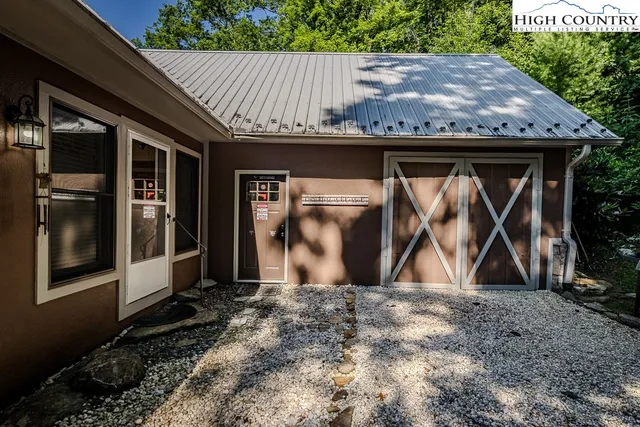 a backyard of a house with wooden fence