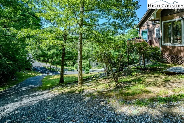 a view of a house with a small yard