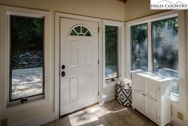 a view of an entryway with front door
